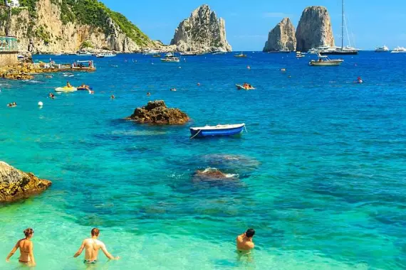 Clear sea with the faraglioni in the distance, on Capri.