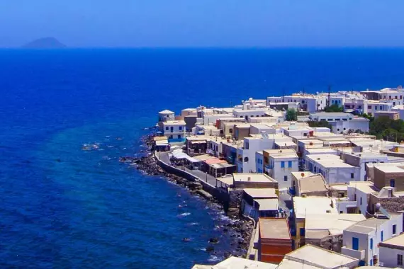 Typical white houses and deep blue sea on Nisyros, in the Dodecanese archipelago.